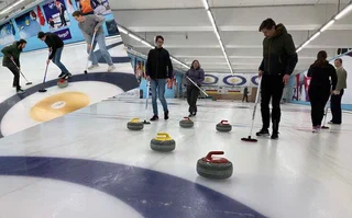 MReye team members at a curling clinic used as analogy for ocular radiotherapy